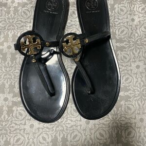 Tory Burch Black Flip Flops with Gold Emblem